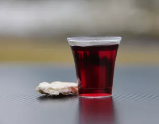 clear drinking glass with red liquid
