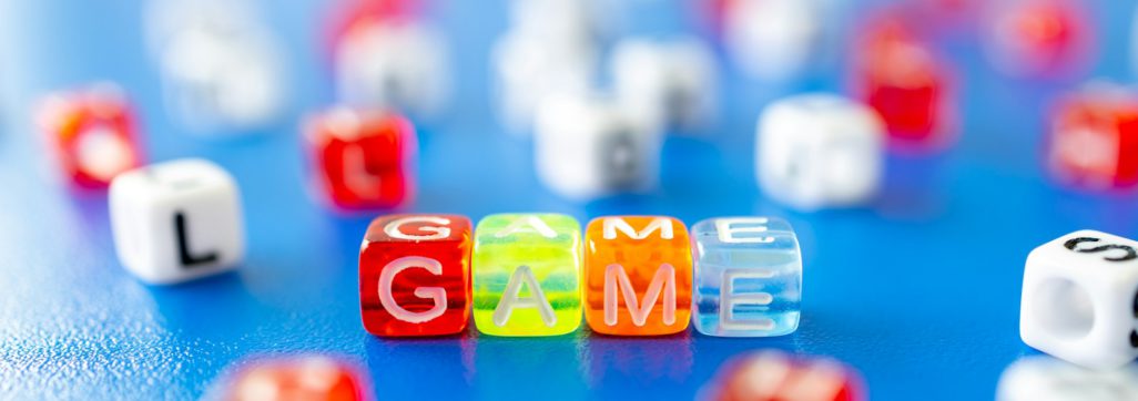 red white yellow and blue plastic dice