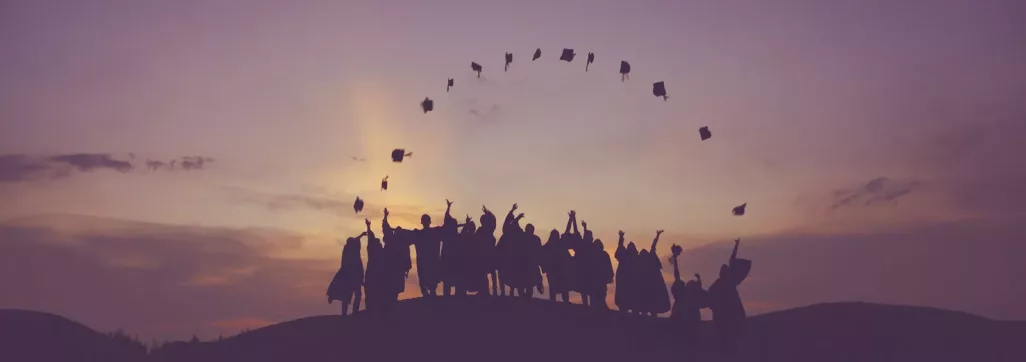 silhouette of people standing on hill